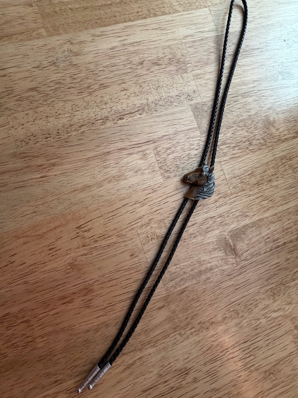 Horse bolo tie with metal tips